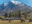 Hotel Las Torres exterior with horse and mountain backdrop