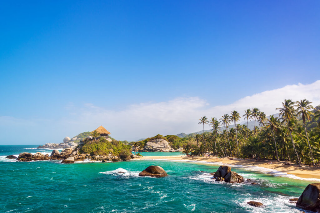 One of Tayrona's beaces with a hut on a hill nearby