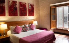 Guest room with king bed in Oxaca, Mexico