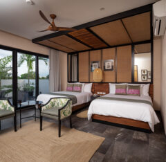 Guest room with a king bed and a single bed
