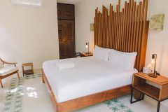 Guest room with a wooden headboard
