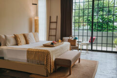 Double suite and view of patio behind sliding doors