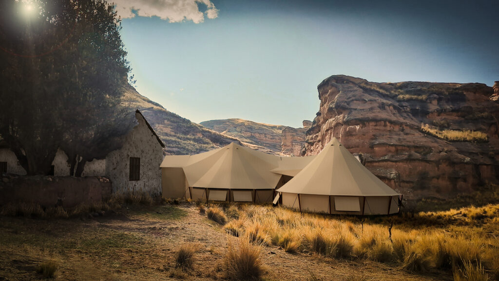 Exterior of tent with view of mountains in the background
