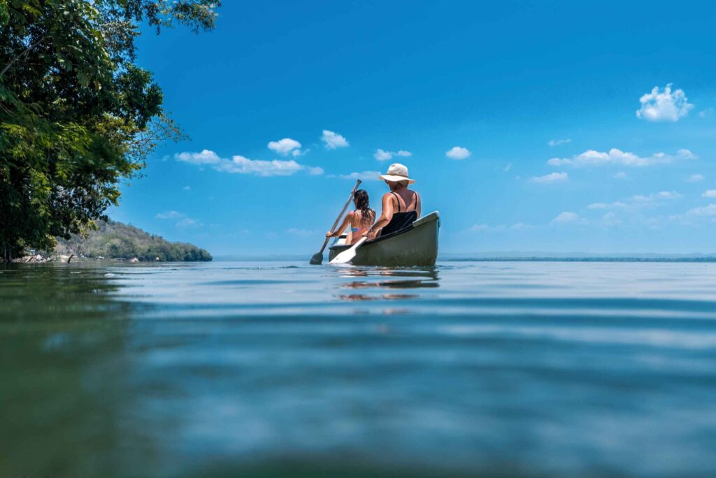 Kayaking along the coastline near La Lancha