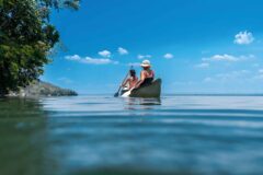 Kayaking along the coastline near La Lancha