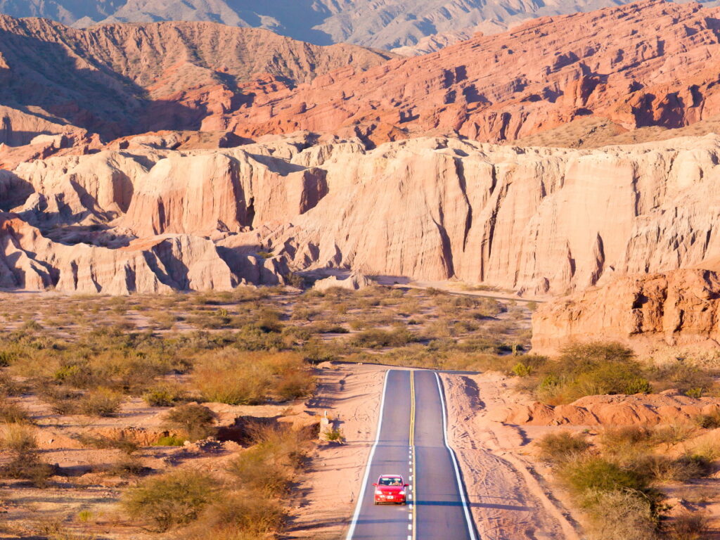 Road into red coloured cliffs in Argentina