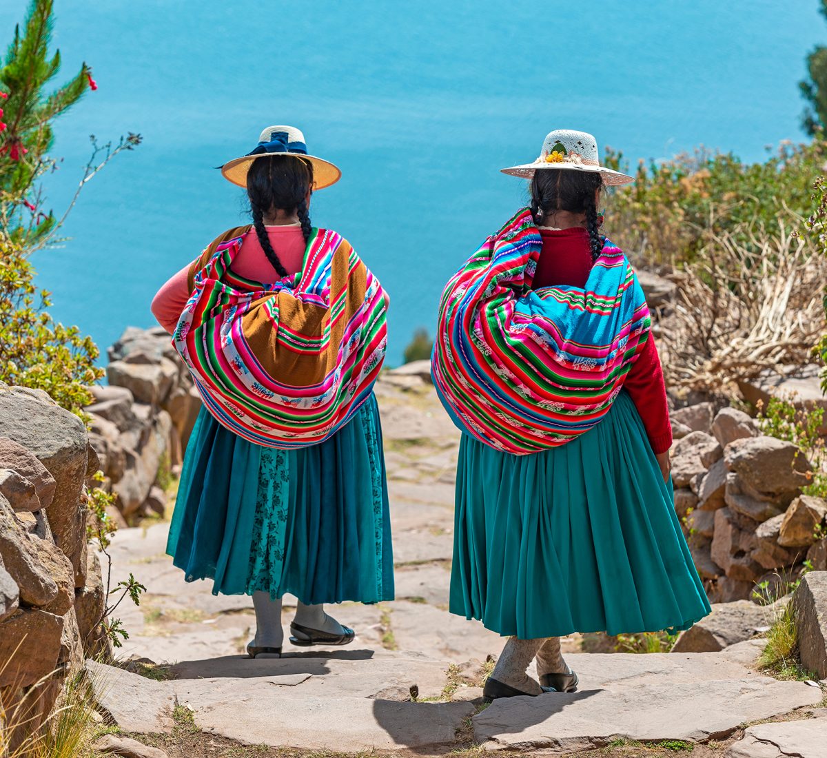 Two,Indigenous,Quechua,Women,In,Traditional,Clothes,Walking,Down,The