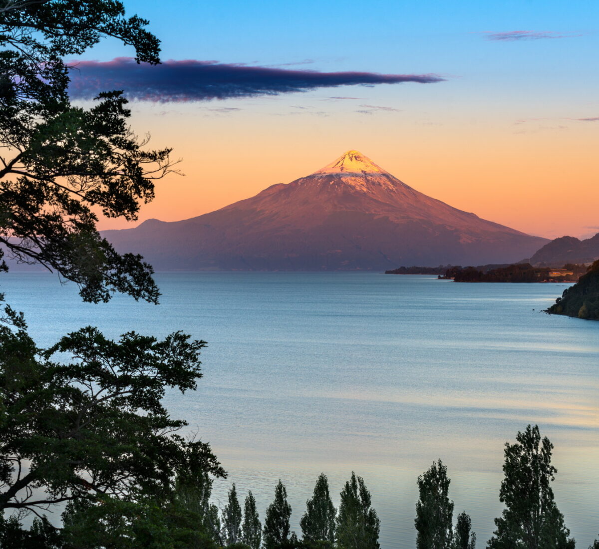 Sun setting over Osorno Lake