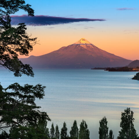 Sun setting over Osorno Lake