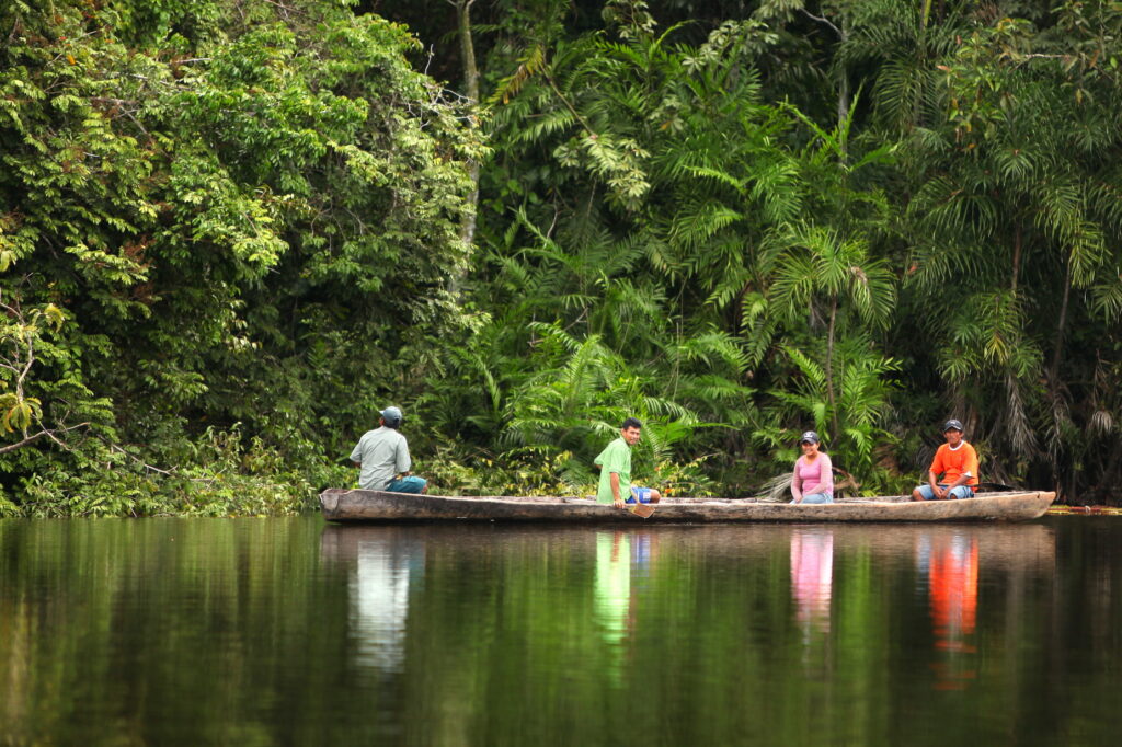 Paddling by canoe in the Amazon