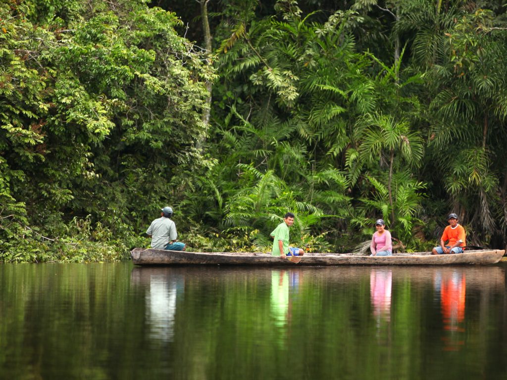 Paddling by canoe in the Amazon
