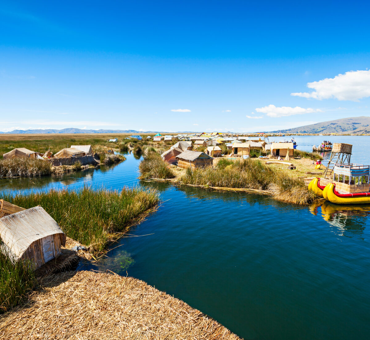 Boats and houses by Lake Titicaca on the Peruvian side