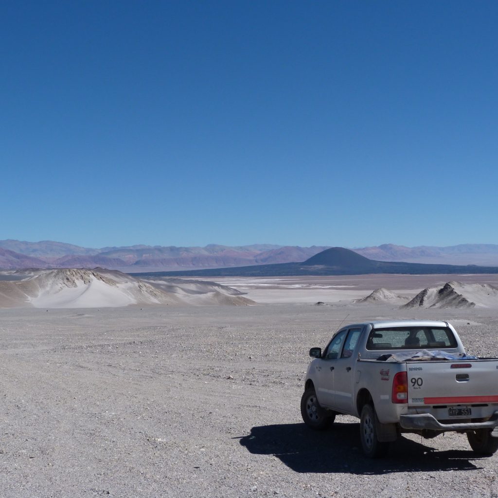 Truck driving over El Penon desert