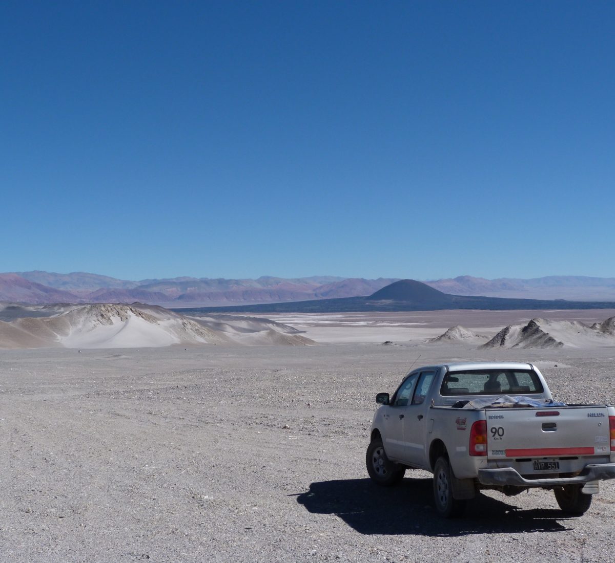 Truck driving over El Penon desert