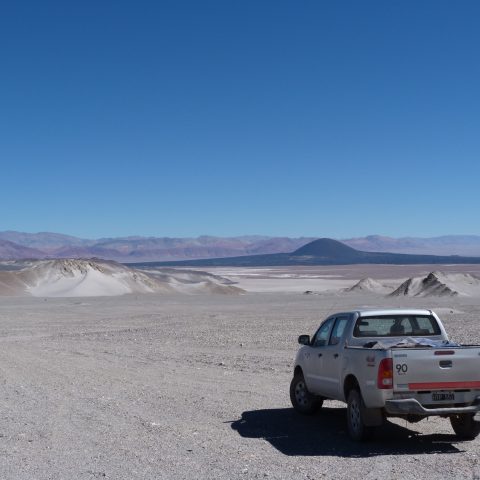 Truck driving over El Penon desert