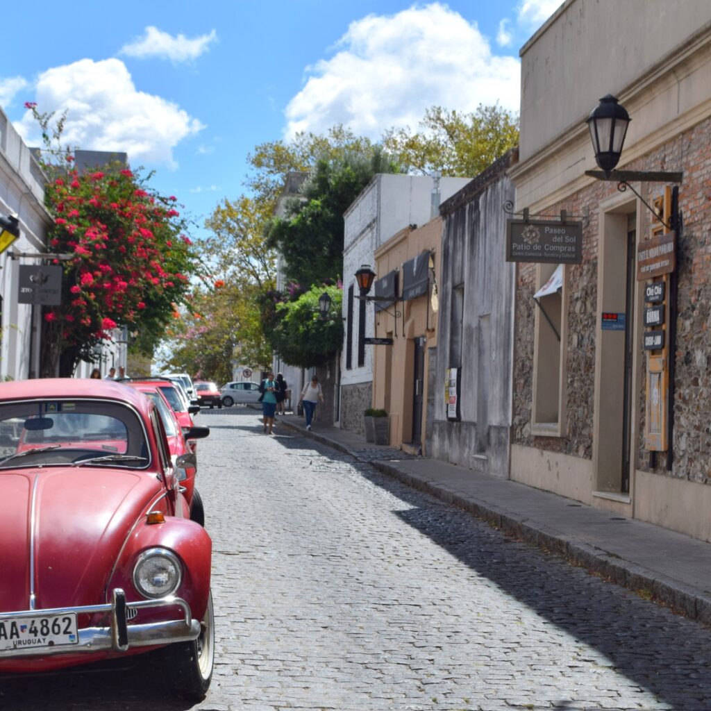 Red car parked on a road in Uruguay