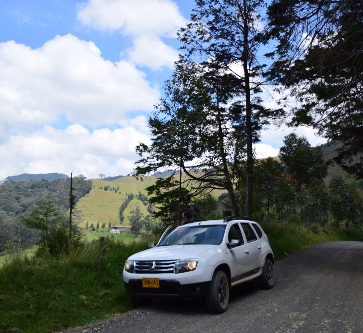 White car parked on a road in Colombia