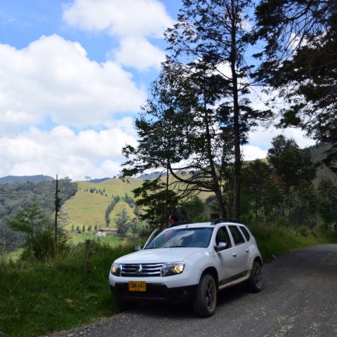 White car parked on a road in Colombia