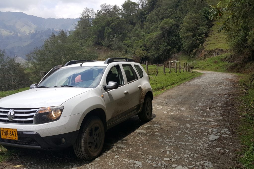 White car parked on a road in Colombia