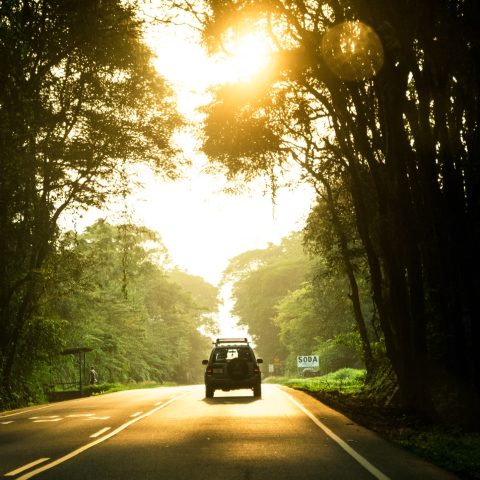 Sillhouette of a car on a road in Costa Rica