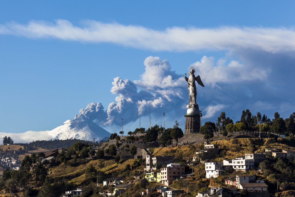 Virgin of Quito statue in El Panecillo overlooking Cotopaxi volcano in Quito, Ecuador