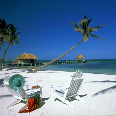 VICTORIA HOUSE  Ambergris Caye,BelizeBeach, chairs & view to jetty