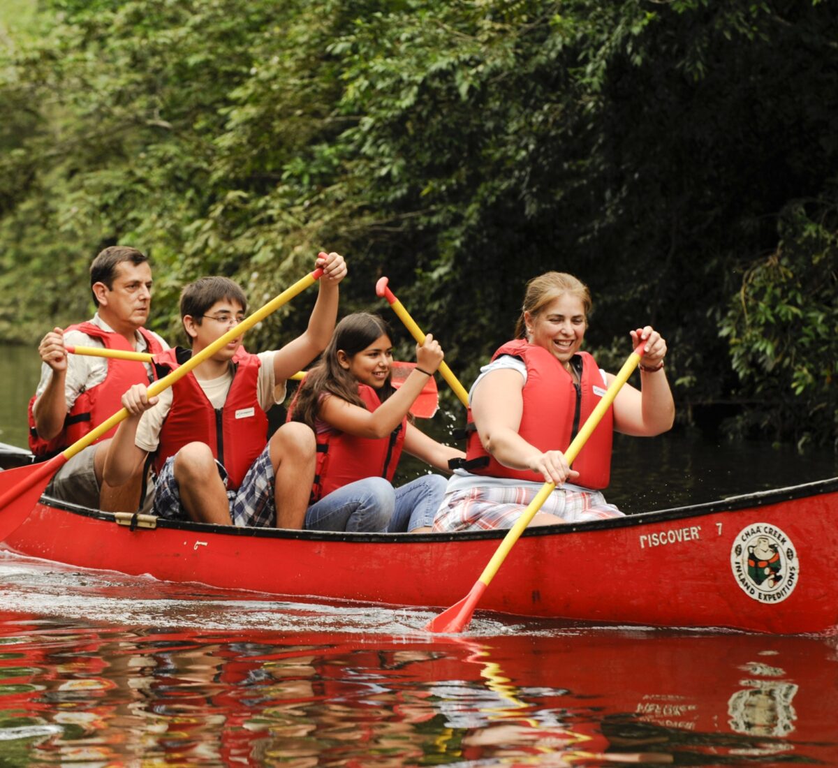 Group paddling on a river in a canoe
