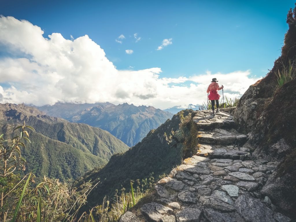 Hiker walking up the trail to Machu Picchu