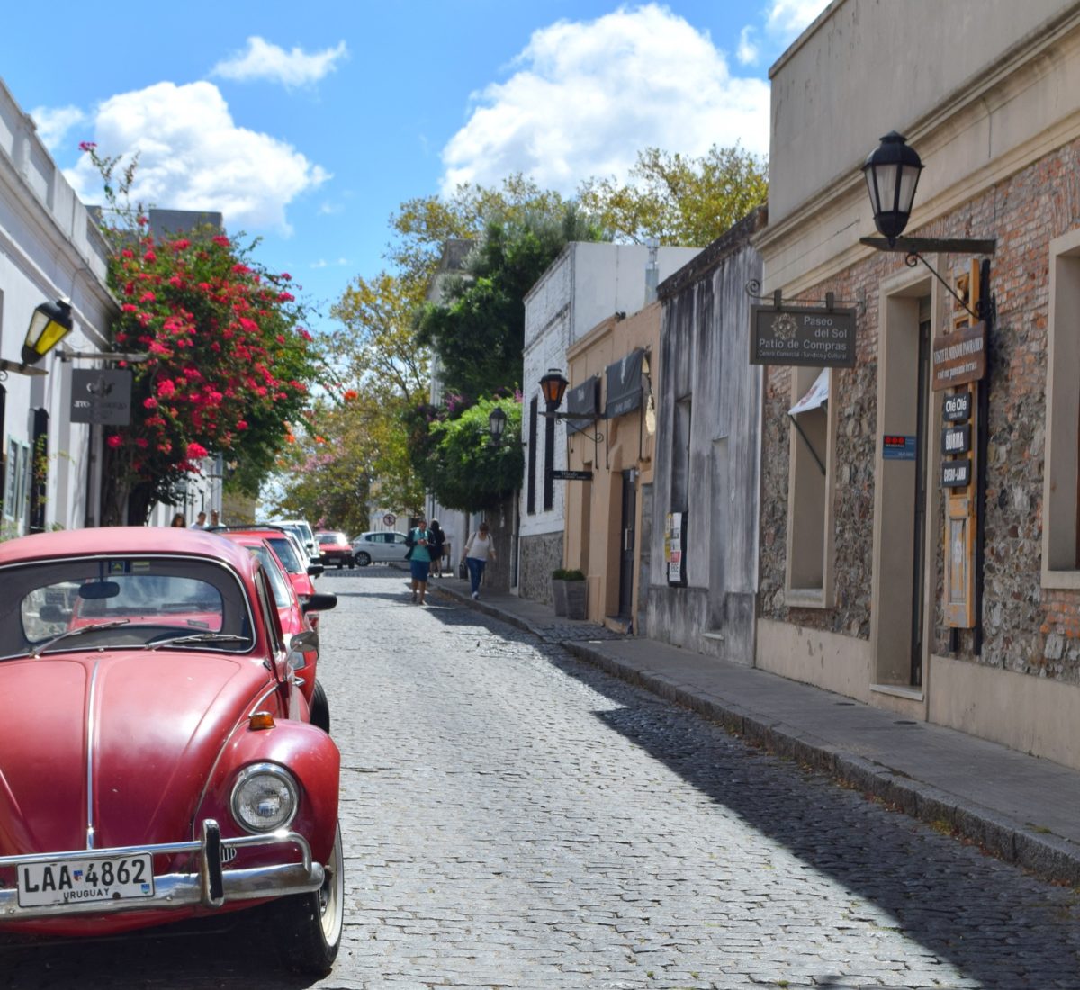 Red car parked on a road in Uruguay