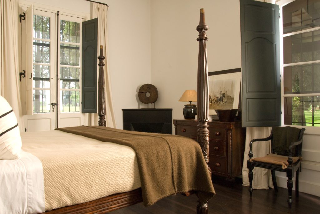 Guest room with king bed in Estancia La Bamba
