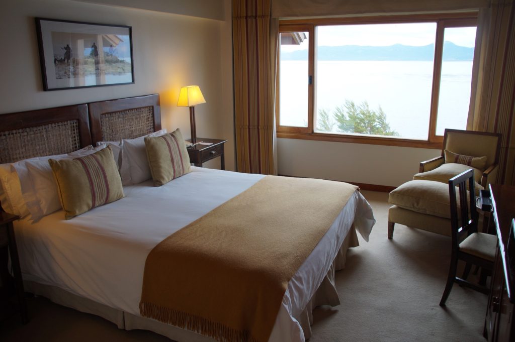 Guest room with king bed and ocean view at Los Cauqenes Resort and Spa