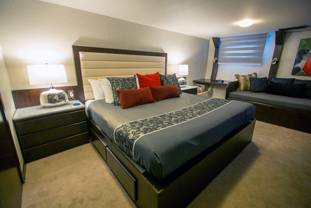 Guest room with a double bed on the Passion ship