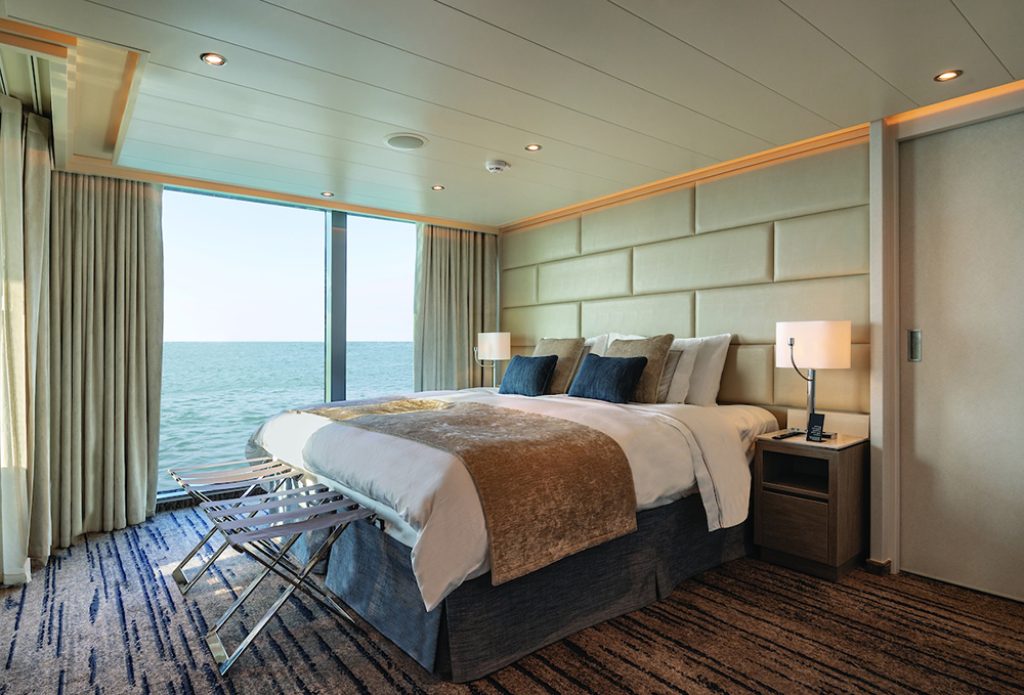Grand Suite with a double bed and ocean view on the Silver Origin