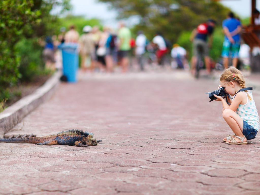 GPS_GirlphotographingIguana_shutterstock126538988_freewithcredit
